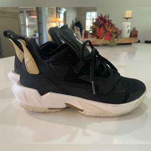 Nike Air Jordan Why Not Zer0.4 Black and Gold Athletic Sneakers